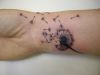 dandelion flower tattoo on wrist