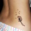 dandelion tattoo on upper hip