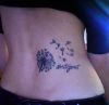 dandelion tattoo on back
