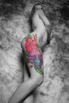 women with hibiscus flower tattoo