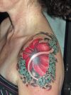 hibiscus girl's shoulder tattoo