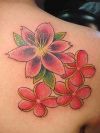 lily flower tats on back