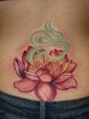 lotus girl's lower back tats