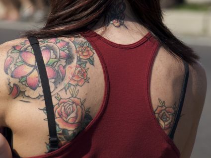 Flower Tattoo On Left Shoulder