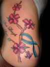flower and blue ribbon tattoo