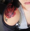 Red rose on shoulder