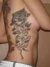 rose tattoo on side back 