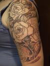 rose tats on arm of man