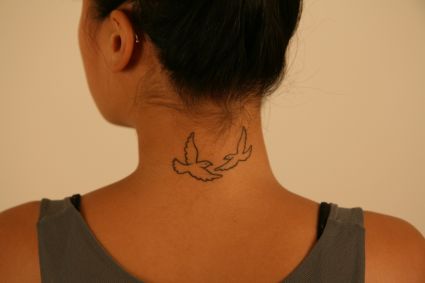 Women With Dove Tattoo