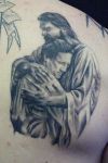 jesus with christian tattoo on back