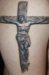 jesus tattoo on thigh
