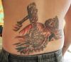 christian man's back tattoo
