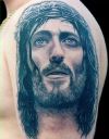 jesus picture tattoos on arm