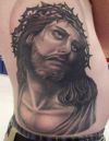 jesus image tattoo on side stomach