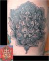 ganesh tattoo with flower