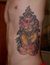 Ganesha tattoo on rib