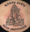 praying hand and text tattoo