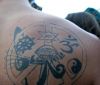 religious symbol tattoo on shoudler