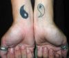 yin and yang tattoo pic on wrist