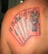 cards left shoulder blade tattoo