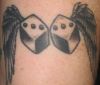 dice and wing tattoo