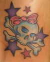 girl skull and star tattoo