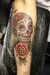 skull and rose tat on arm