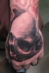skull tat on wrist