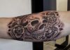 skull elbow tattoo