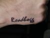 roadhogg text tattoo on hand