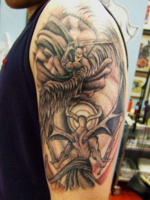 Angel Fighting Demon Tattoo On Arm