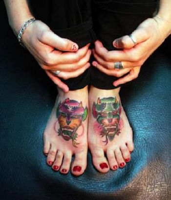 Demon Face Tattoo On Feet