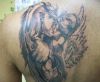 demon and angel tattoo on left shoulder blade