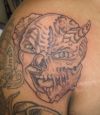 demon face tattoos on shoulder