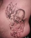 demon tattoo on side stomach