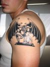 demon wing tattoo on arm