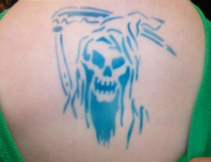 Grim Reaper Tattoo On Back Of Girl