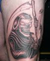 grim reaper pic tattoo on thigh