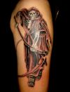 grim reaper tattoo image on arm