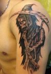 grim reaper tattoo image on left arm
