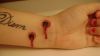 vampires bite tattoo on wrist