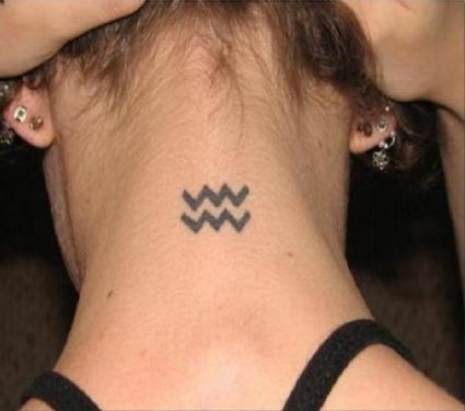 Aquarius Tattoo On Back Of Neck Of Girl