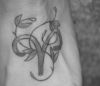 aries sign and vine tattoo on feet