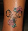 aries tattoo with flower