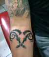 aries tribal tattoo on arm