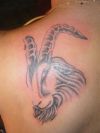 capricorn pic tattoo on left arm shoulder