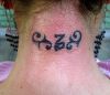 capricorn sign tattoo on back of neck