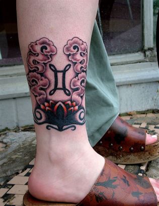 Gemini Sign And Flower Tattoo On Leg