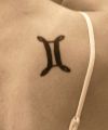 gemini symbol tattoo on neck