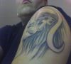 leo pics tattoo on arm